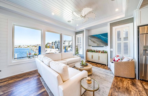 Stone Harbor Casa | Discover an extraordinary waterfront haven with this magnificent bayfront residence that boasts a.