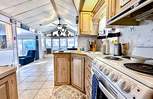 Port Isabel Casa | Dog-friendly bayfront home with in/outdoor pools, tennis, gym, W/D, bay views
