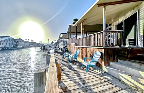 Port Isabel Casa | Dog-friendly bayfront home with in/outdoor pools, tennis, gym, W/D, bay views