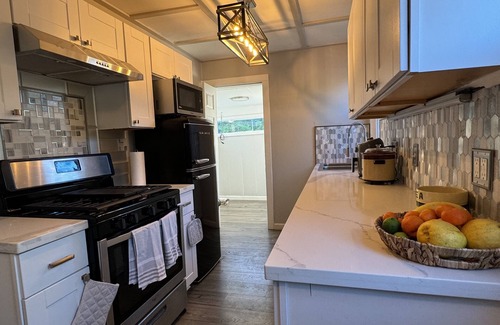 Sunland Casa | Dog friendly cottage with porch, pool, massive yard, and plenty of parking.