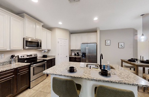 Westside Casa | Dog-friendly home with a screened porch, washer/dyer, games & modern charm