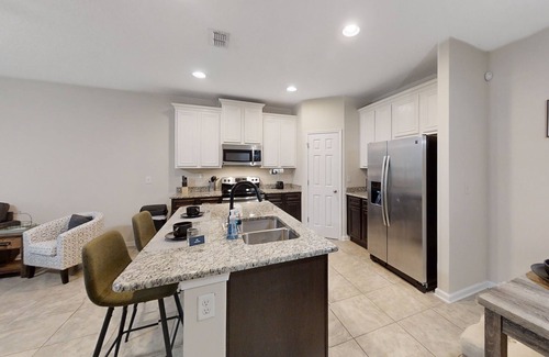 Westside Casa | Dog-friendly home with a screened porch, washer/dyer, games & modern charm