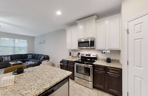 Westside Casa | Dog-friendly home with a screened porch, washer/dyer, games & modern charm