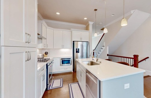 Hitch Village - Fred Wessels Homes Casa | Dog-friendly townhouse with modern kitchen, balcony, garden tub, & central AC