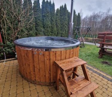 Podjazy Casa | Domek nad stawem z balią i sauną