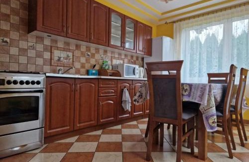 Podjazy Casa | Domek nad stawem z balią i sauną