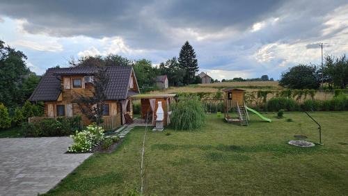 gmina Sułow Casa | Domki nad Nieliszem- dom kwiatowy