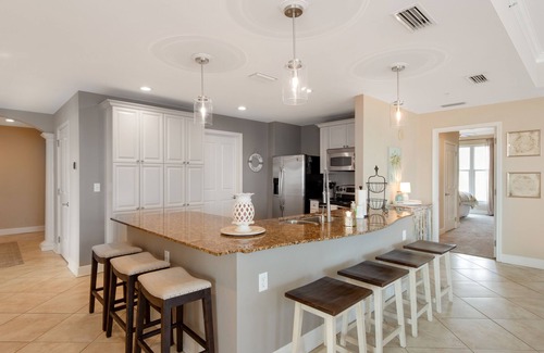 Upper Grand Lagoon Condominio | Elegant Fourth Floor Condo with Shared Pool & Hot Tub, Ocean View, and WiFi
