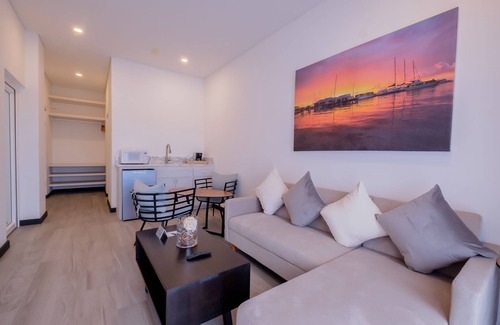 San Pedro Hotel | Enjoy a gorgeous master suite with a full kitchen, king bed, and balcony!