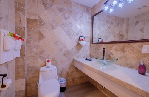 San Pedro Hotel | Enjoy a gorgeous master suite with a full kitchen, king bed, and balcony!