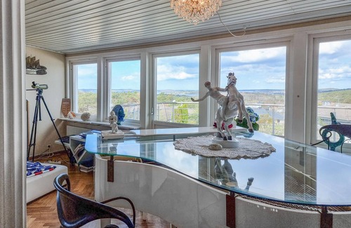 Vastra Frolunda Casa | Enjoy a wonderful view of the archipelago in this comfortable vacation home with sauna.