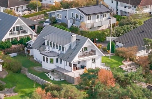Vastra Frolunda Casa | Enjoy a wonderful view of the archipelago in this comfortable vacation home with sauna.