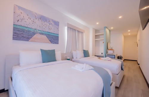 San Pedro Hotel | Enjoy gorgeous views of the island through a private balcony!