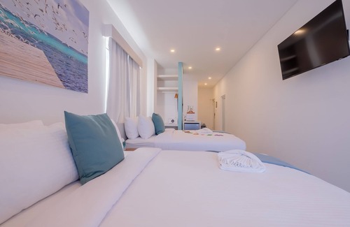 San Pedro Hotel | Enjoy gorgeous views of the island through a private balcony!