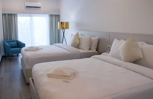 San Pedro Hotel | Enjoy gorgeous views of the island through a private balcony!