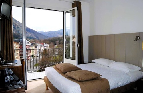 Lourdes Hotel | Enjoy Homelike Comfort & Balcony Sights w/Modern Amenities in Lourdes
