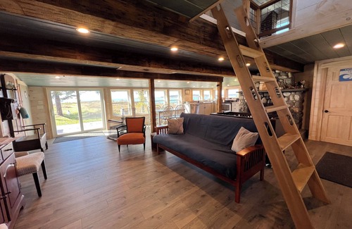Mid-Coast and Islands Casa | Enjoy picturesque inlet views of a working harbor and sunny days at your oceanfront cottage