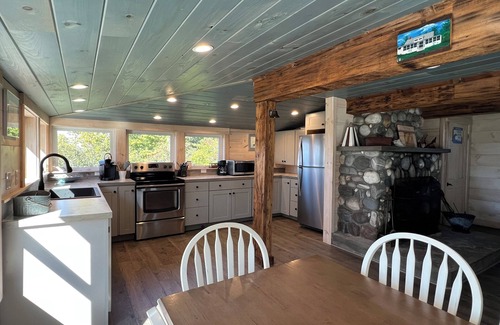 Mid-Coast and Islands Casa | Enjoy picturesque inlet views of a working harbor and sunny days at your oceanfront cottage