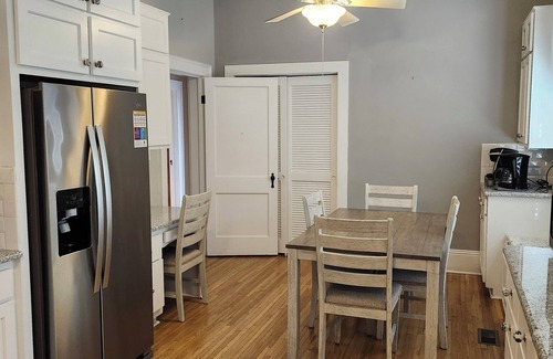 Mount Airy Casa | Enjoy small-town, Main Street from the front porch of this historic bungalow!