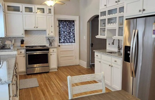 Mount Airy Casa | Enjoy small-town, Main Street from the front porch of this historic bungalow!