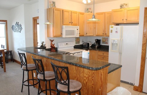 Manteo Condominio | Sailfish Point Villa 5201 - Maravilloso condominio frente al puerto deportivo