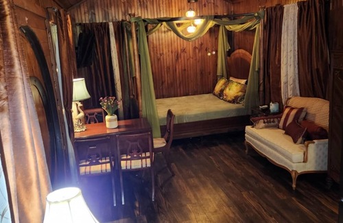 Hamptonville Cabaña | Escape to a Hobbit cottage overlooking a pond with water wheel in wine country!
