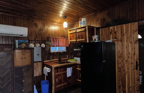 Hamptonville Cabaña | Escape to a Hobbit cottage overlooking a pond with water wheel in wine country!