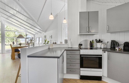 Kirke Hyllinge Casa | Experience a wonderful break in this holiday home with fjord views.