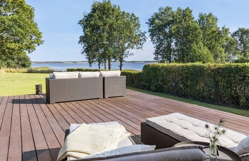 Kirke Hyllinge Casa | Experience a wonderful break in this holiday home with fjord views.