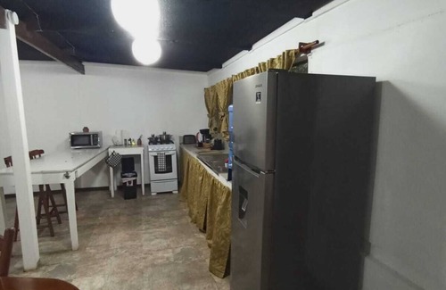 San Ignacio Apartamento | Experience comfort and relaxation in our air-conditioned apartment, featuring two spacious bedrooms, a welcoming living room, a fully equipped private kitchen, and a well-appointed private bathroom. Perfect for families or groups.