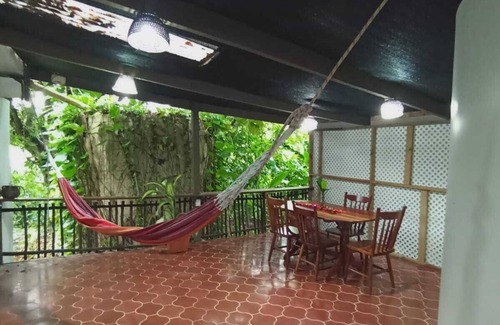 San Ignacio Apartamento | Experience comfort and relaxation in our air-conditioned apartment, featuring two spacious bedrooms, a welcoming living room, a fully equipped private kitchen, and a well-appointed private bathroom. Perfect for families or groups.