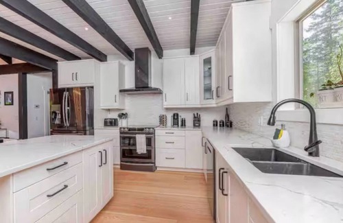 Swansea Point Casa | Extraordinary home with pool,hot tub, sauna, gym, arcade & theatre.