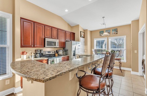 North Myrtle Beach Casa | Family friendly spacious Barefoot townhome w/ neighborhood pool & 4 golf courses