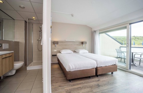 Westkapelle Hotel | Family Fun by the Sea with Play Area, Pool & Sandy Adventures Nearby