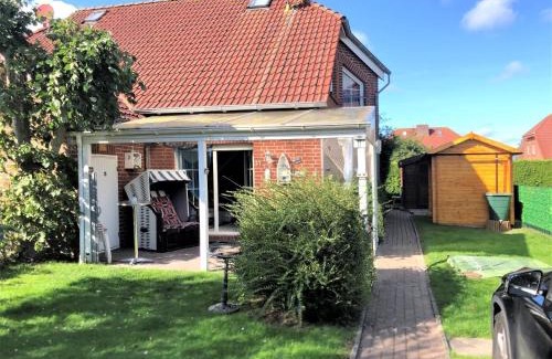 Neßmersiel Casa | Ferienhaus Huus Wattenmeer in Nessmersiel mit Garten, Terrasse, Sauna, Räder, und Grill