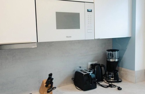 Tannenhausen Casa | Ferienhaushälfte Wasserseite - Küsten Apartments Tannenhausen
