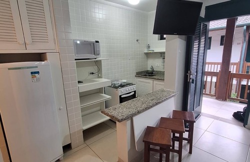Praia do Pauba Apartamento | Flat Praia de Pauba, right on the sand, heated pool, barbecue and sauna.