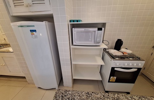 Praia do Pauba Apartamento | Flat Praia de Pauba, right on the sand, heated pool, barbecue and sauna.