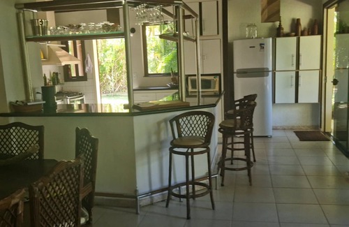 Guaiu Casa | Flower house on the edge of Guaiú beach in a high-standard condominium.
