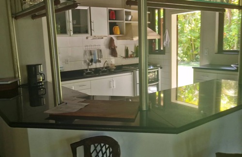 Guaiu Casa | Flower house on the edge of Guaiú beach in a high-standard condominium.