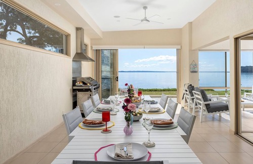 Salamander Bay Casa | Foreshore Delight offers a tranquil holiday retreat with breathtaking water views