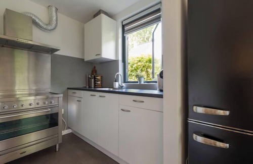 Ewijk Casa | Forest Cottage Ewijk incl. hot tub by Interhome