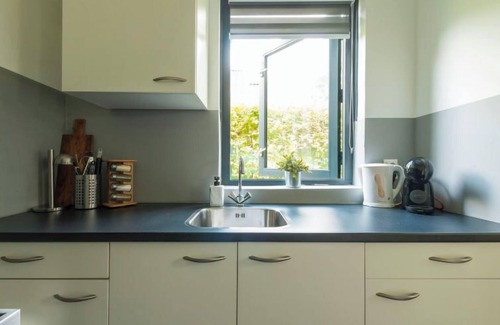 Ewijk Casa | Forest Cottage Ewijk incl. hot tub by Interhome