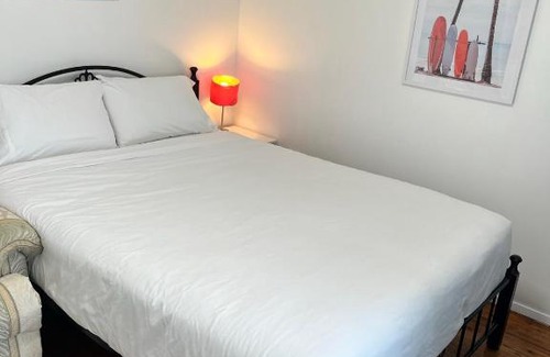 Doonside Casa | Fragrant Homes-68B independent aircon room, with 65’TV, queen size beds, rest sofa, built in wardrobe