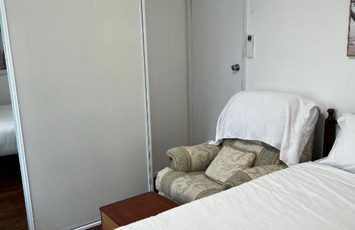Doonside Casa | Fragrant Homes-68B independent aircon room, with 65’TV, queen size beds, rest sofa, built in wardrobe