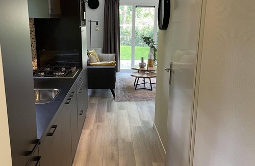 Terwolde Casa | Freestanding chalet for four persons, fully furnished. Located at the water.