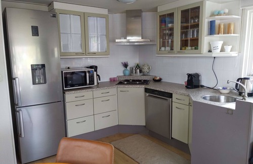 Terwolde Casa | Freestanding chalet for four persons, fully furnished. Located at the water.
