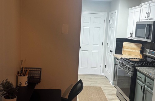 Church Street Casa | Fully Furnished Modern Home Patio with BBQ Grill for Relaxed Outdoor Living