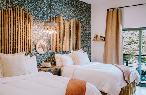 Wimberley Hotel | Gaines Ranch on the Square | The Corral Suite | 2 Queens | Downtown Wimberley