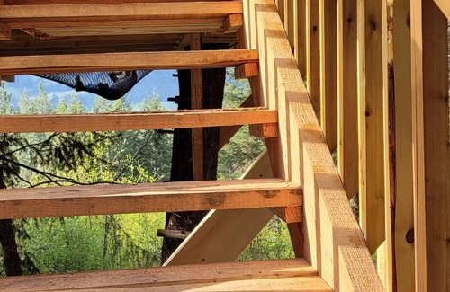 Armstrong Casa | Glamping in the woods with this Treehouse built in between 2 big alive Fir Tree